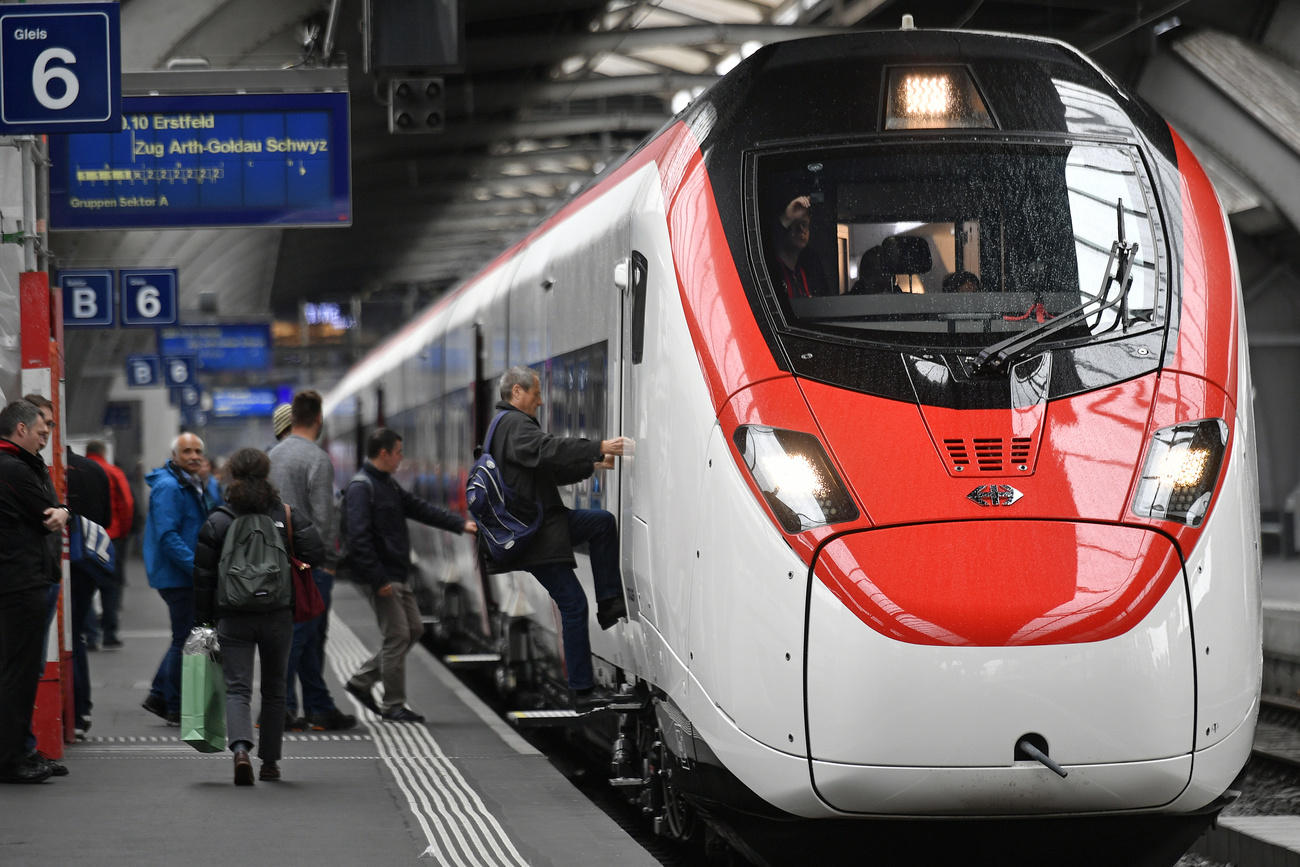 People board a Federal Railways train