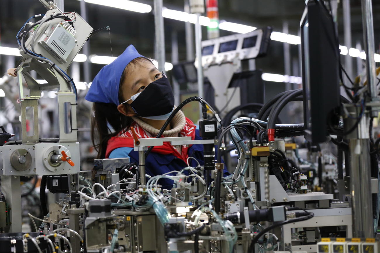 Workers resume work at an electronic components factory in Wuhan China