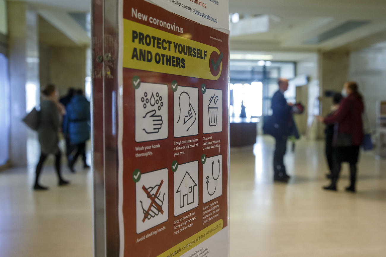 Information regarding the new coronavirus is displayed throughout the European headquarters of the United Nations in Geneva