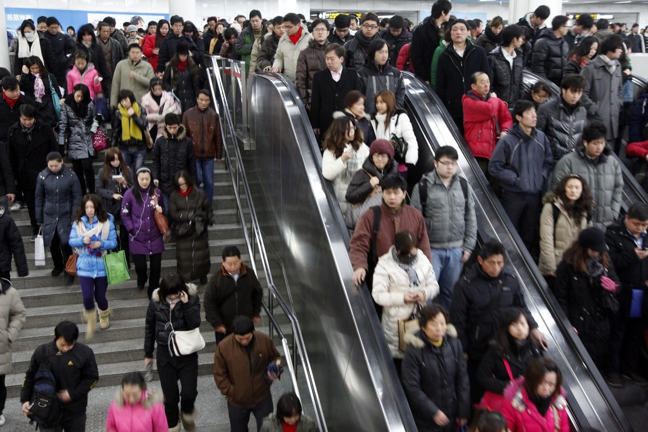 Morning commuters at a subway station in Shanghai, China, in 2011.