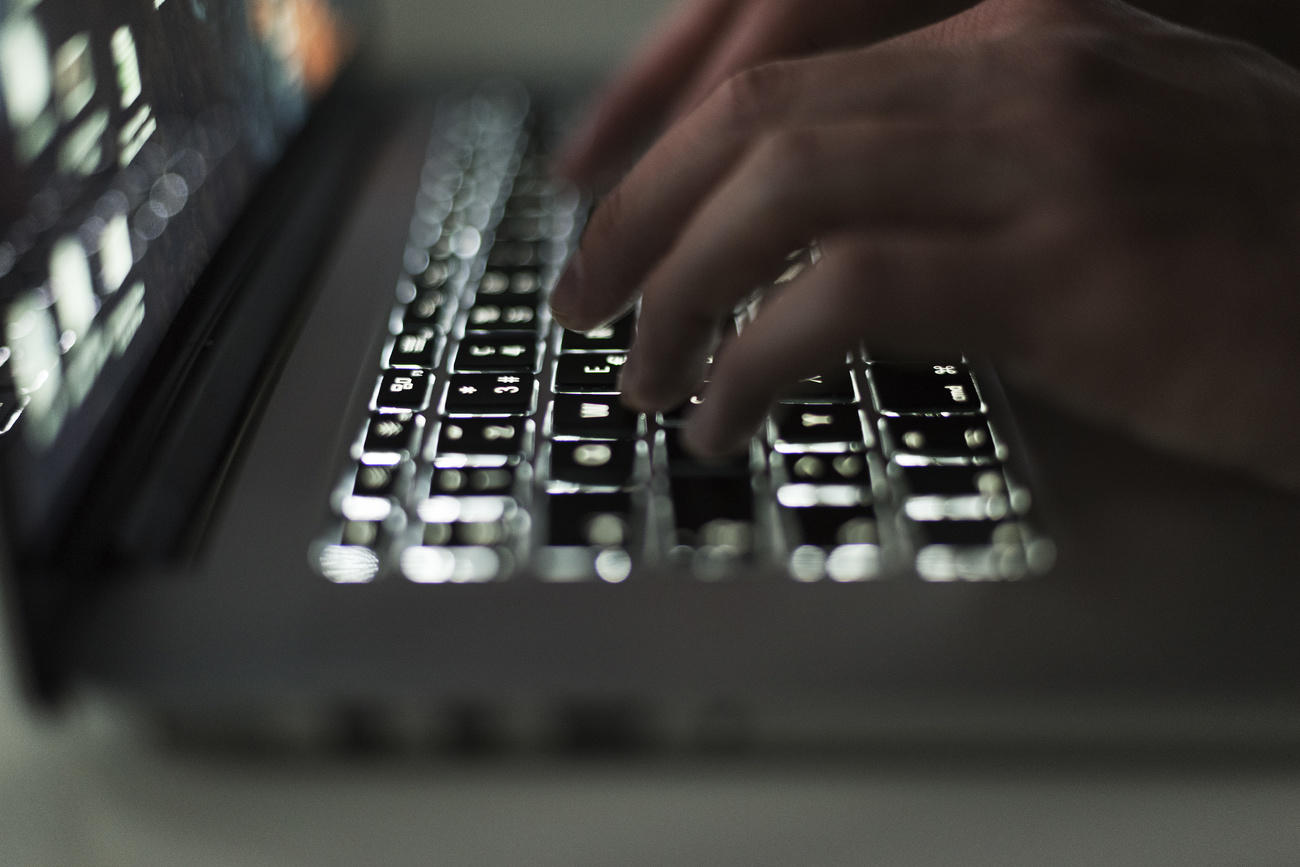 person typing on computer
