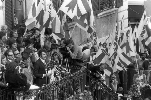 Crowd of people with flags