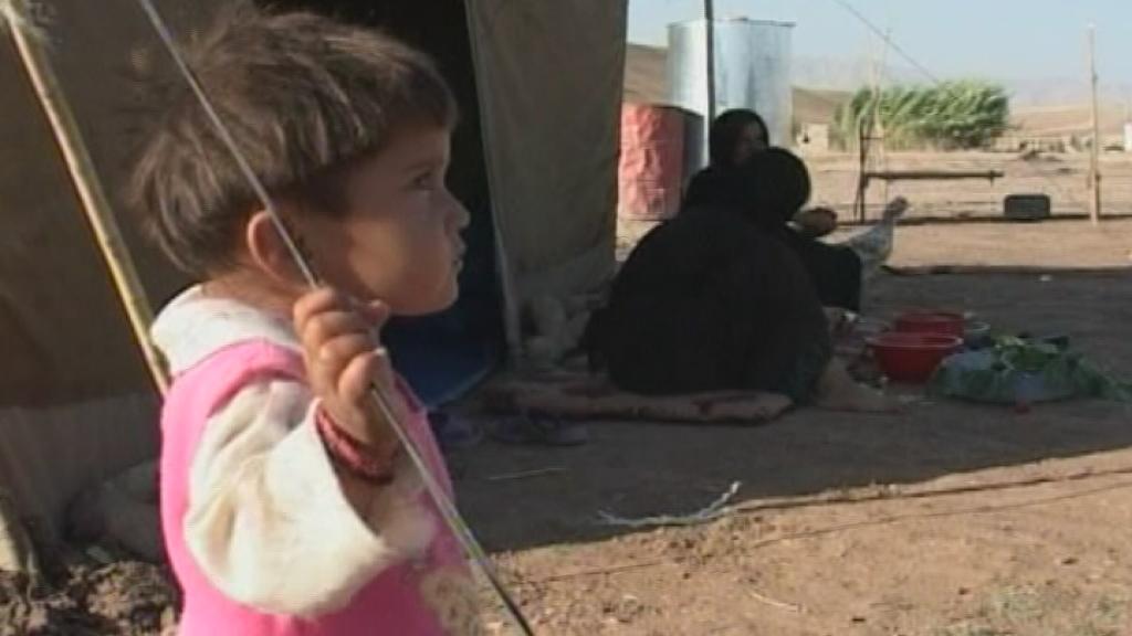 a little girl in a refugee camp