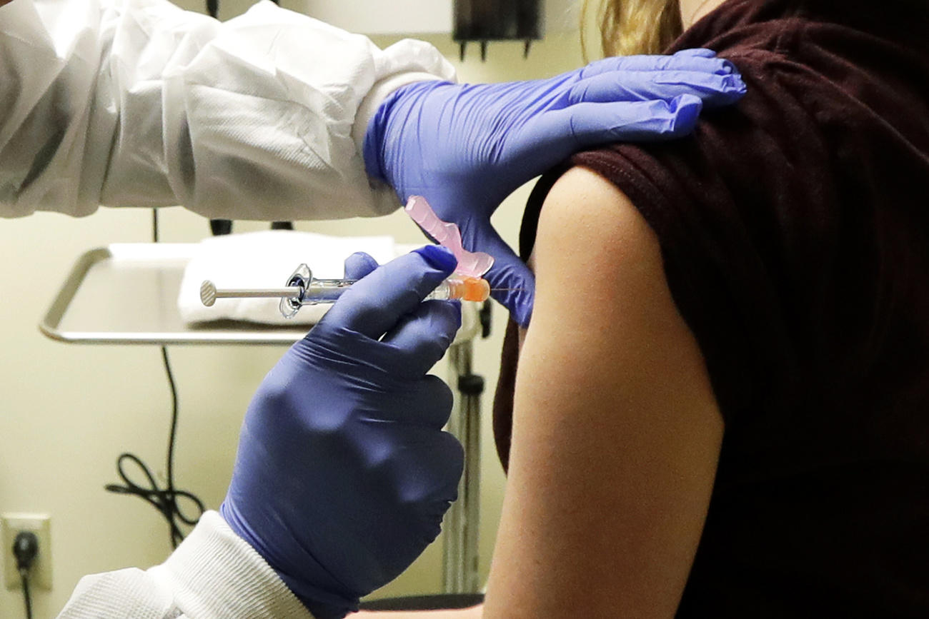 Person being injected with syringe