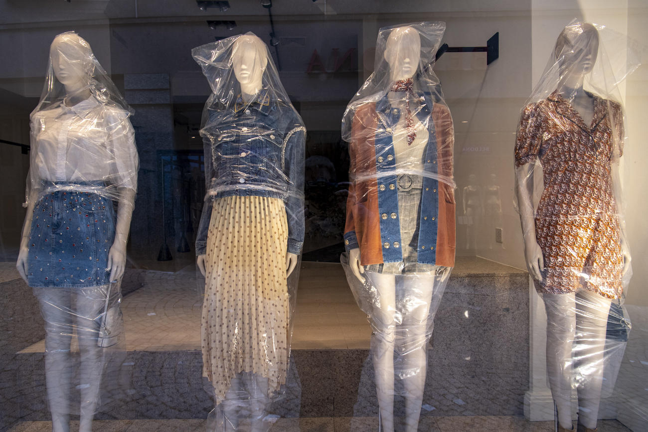 Shop window dummies covered in plastic