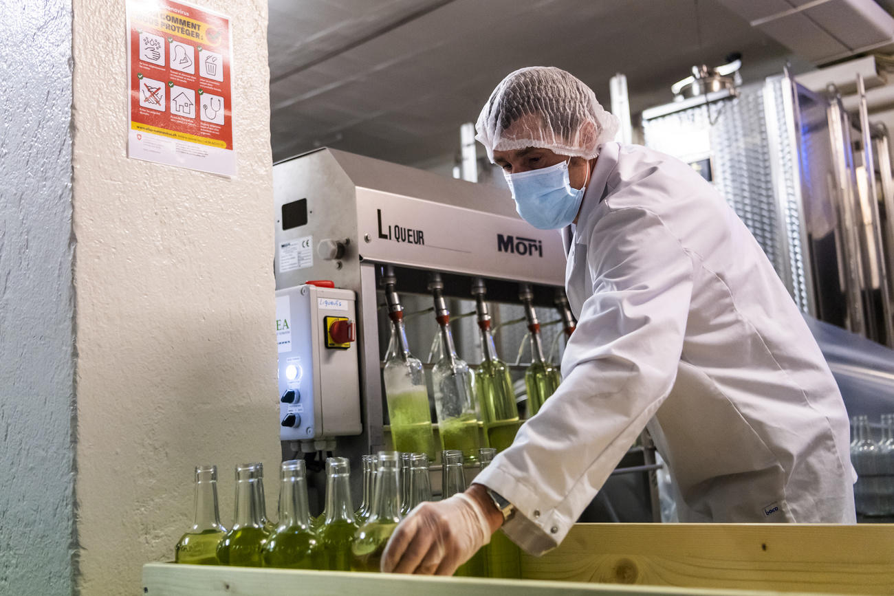 A worker produces disinfecting hand gel