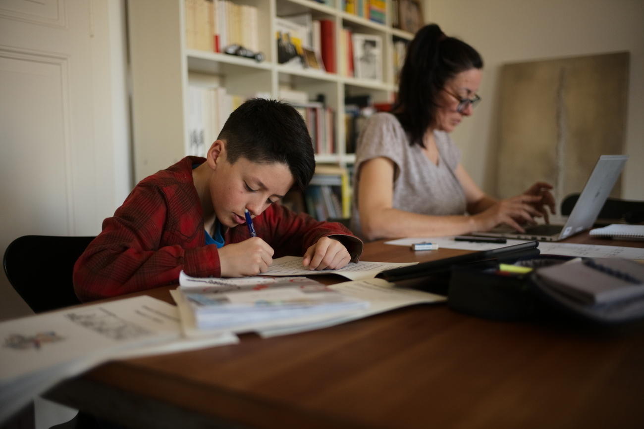 Mother and son working at home