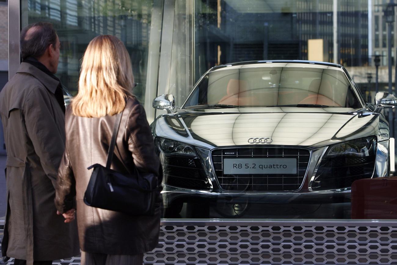 Couple looking at a new car