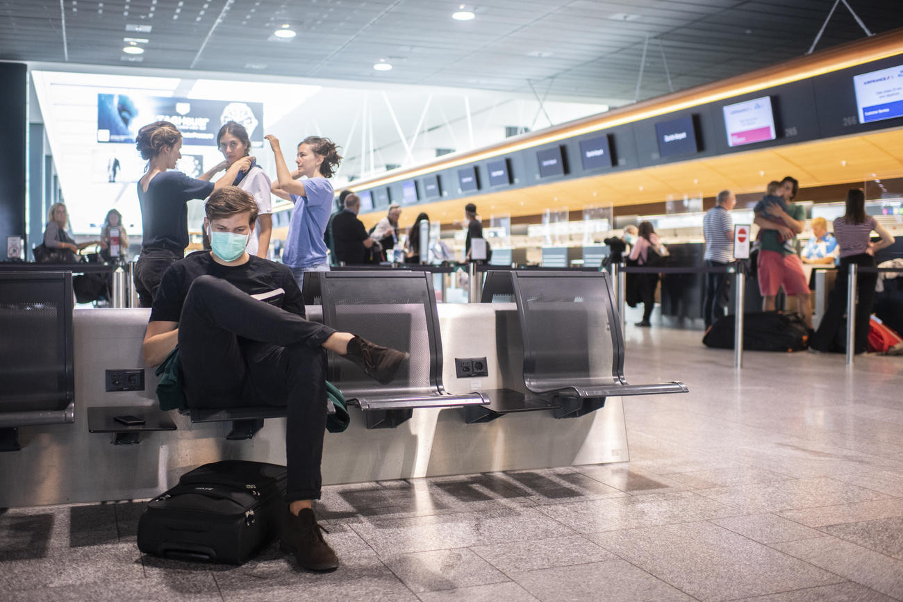 Airport terminal with masked passengers