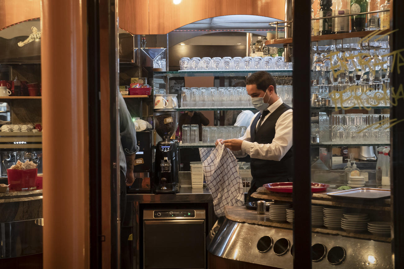 WAITER IN CANTON TICINO WEARING A MASK