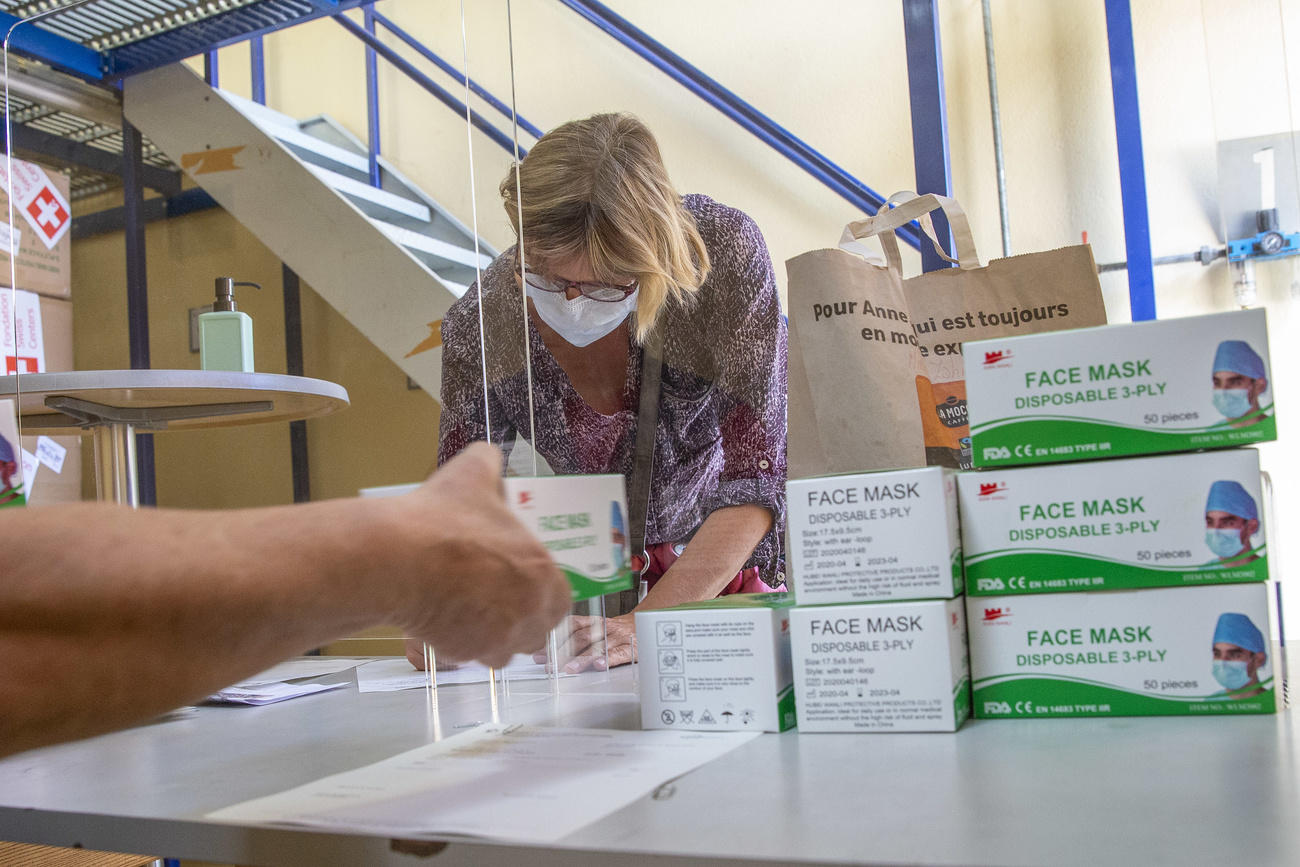 A therapist receives boxes of facial masks