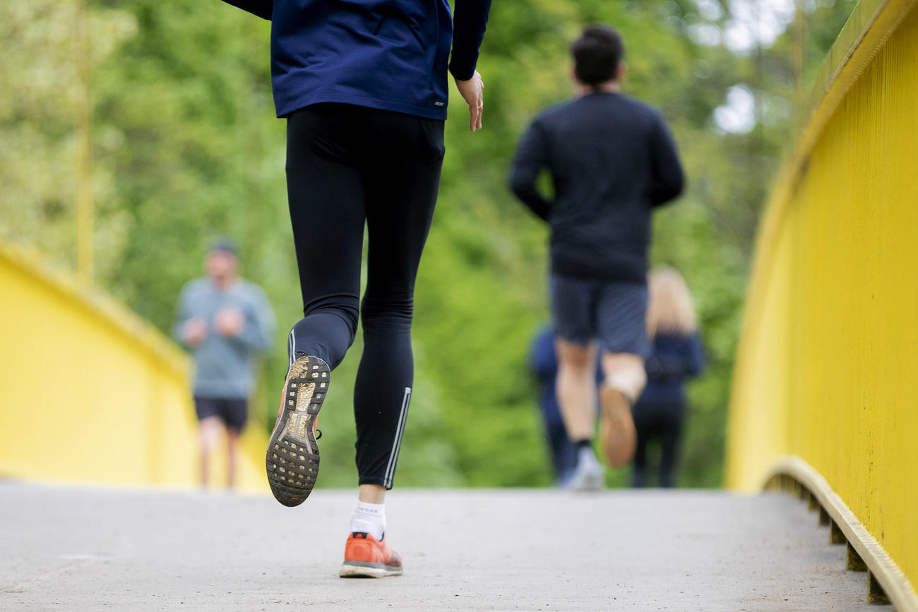 Joggers on a bridge