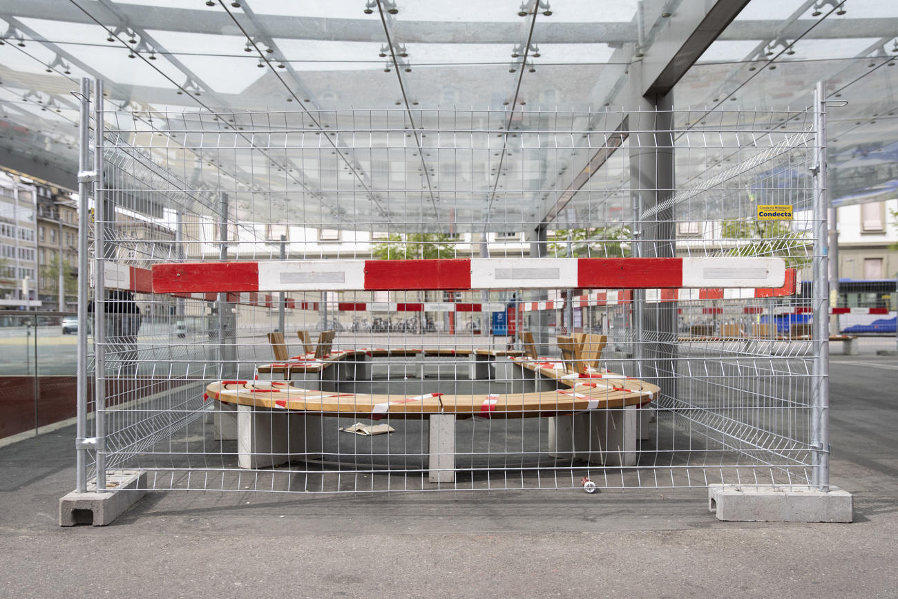 Fenced-off bench at bus station