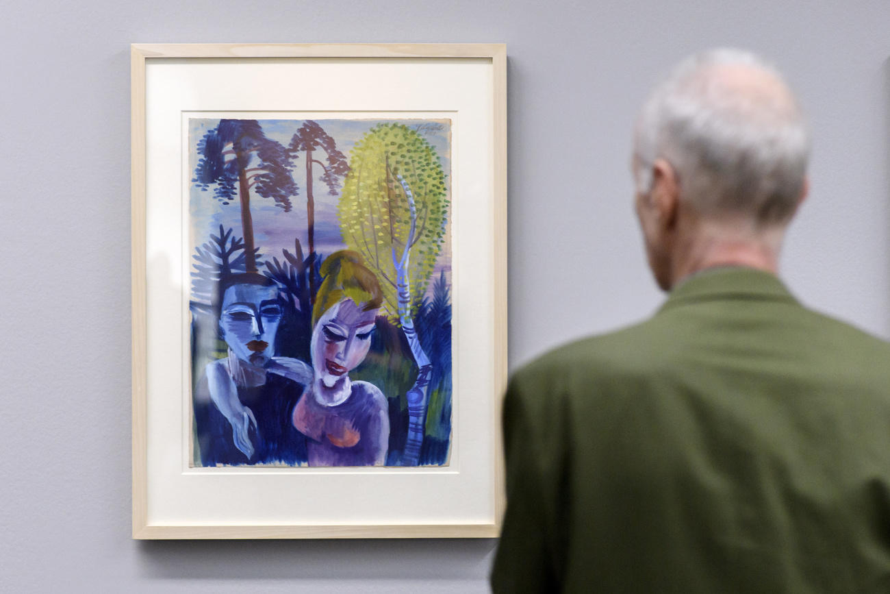 Man looking at painting