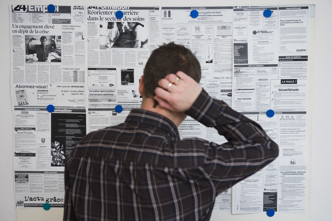 Man in front of white board with job adverts