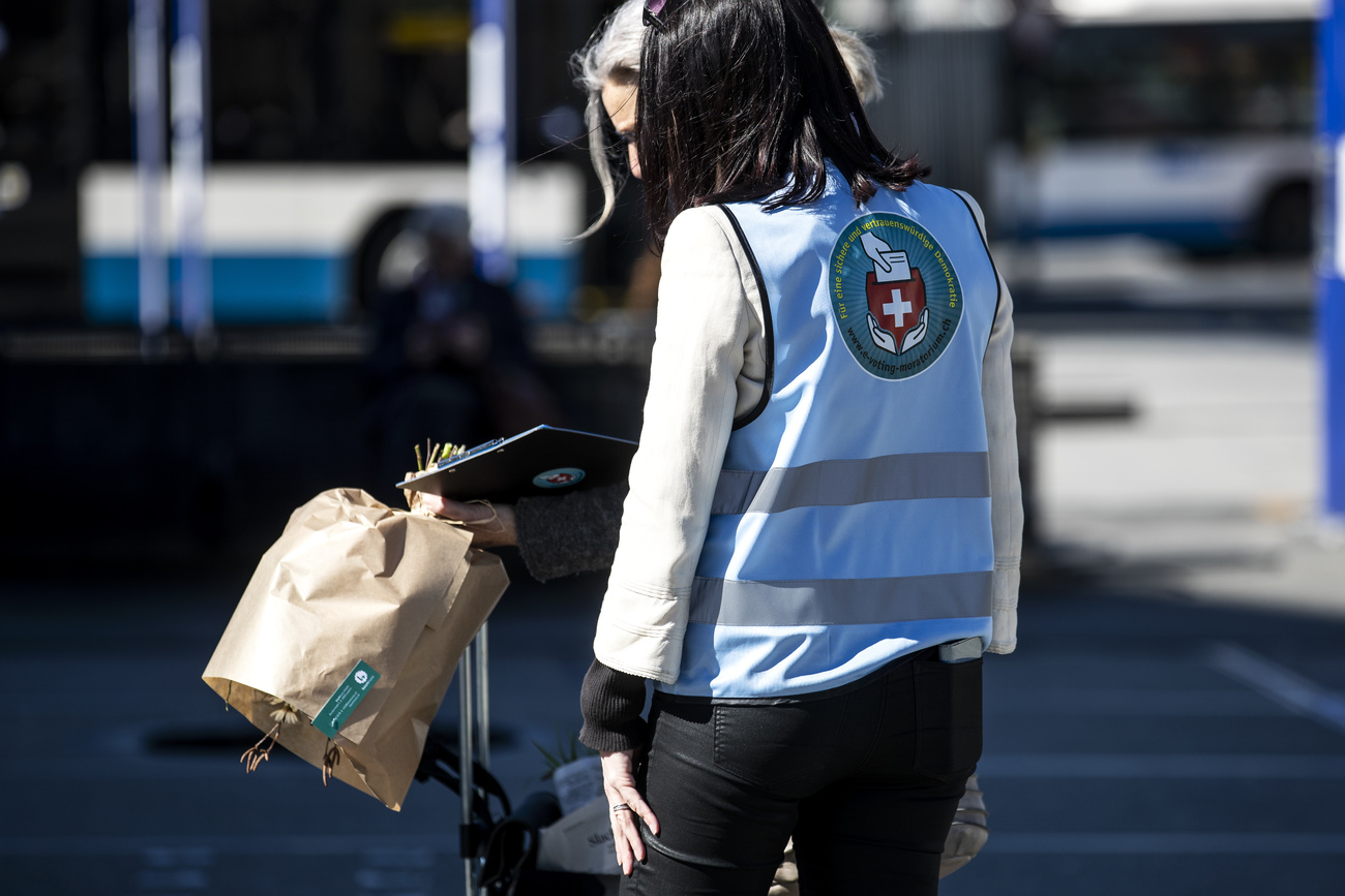 Campaigner collecting signatures in the streets