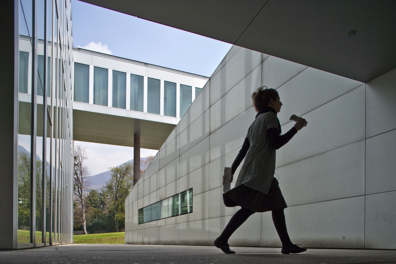 Girl walking past USI architecture building