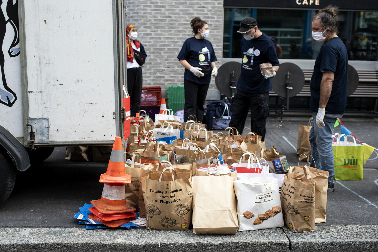 People with numerous grocery bags