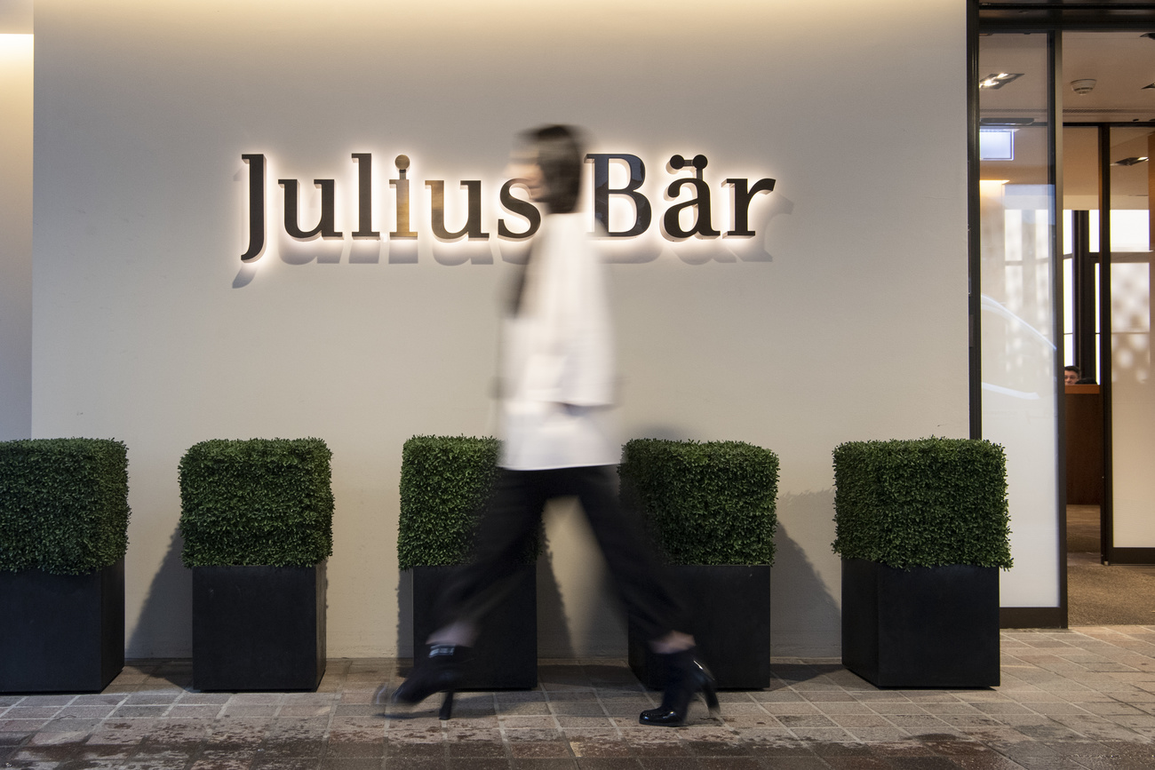 Woman walking past Julius Baer offices