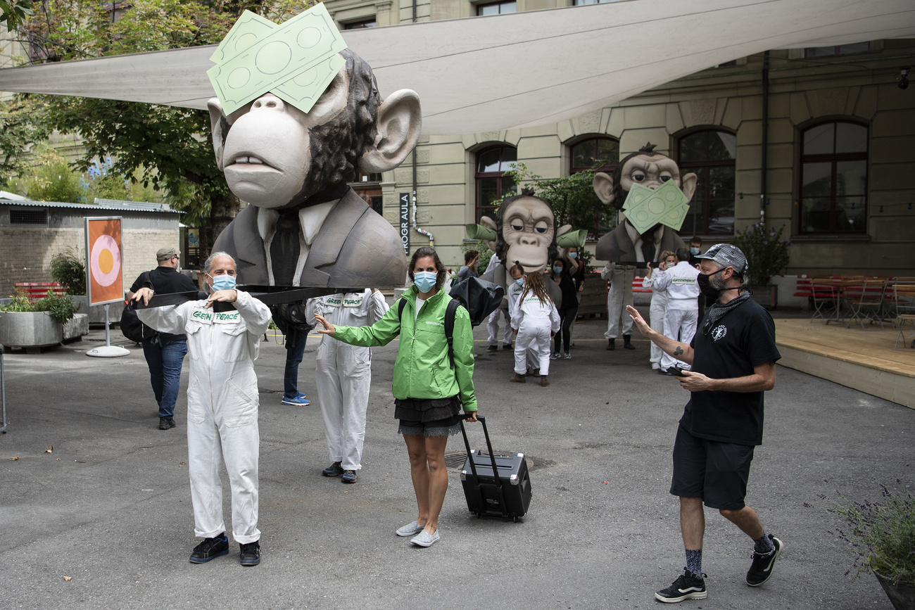 Demonstrators with giant monkey head