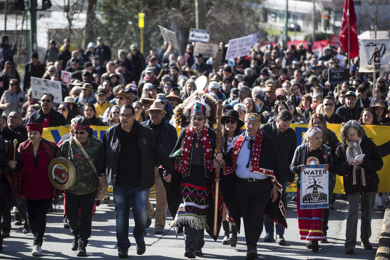 Indigenous chiefs and elders lead thousands of people on a protest in Canada.