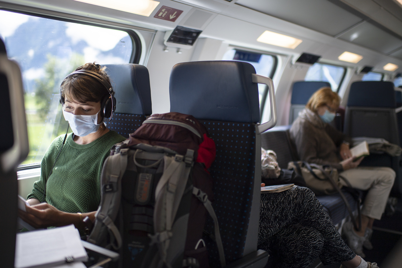 masked woman in train