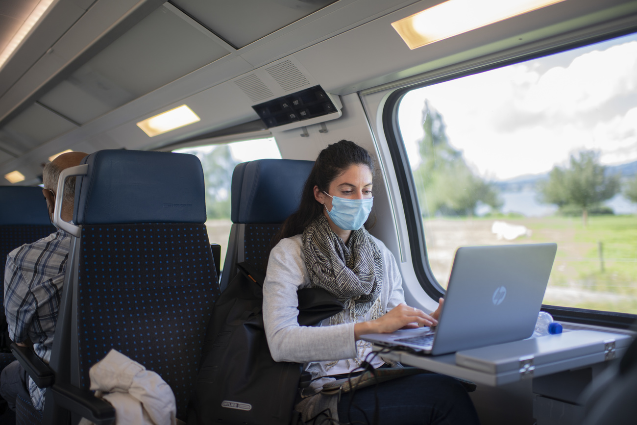 Woman wearing face mask on Swiss train