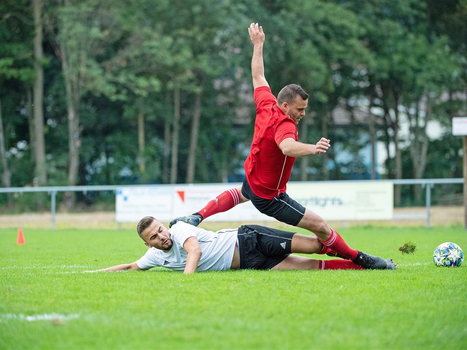 Two players compete for the ball