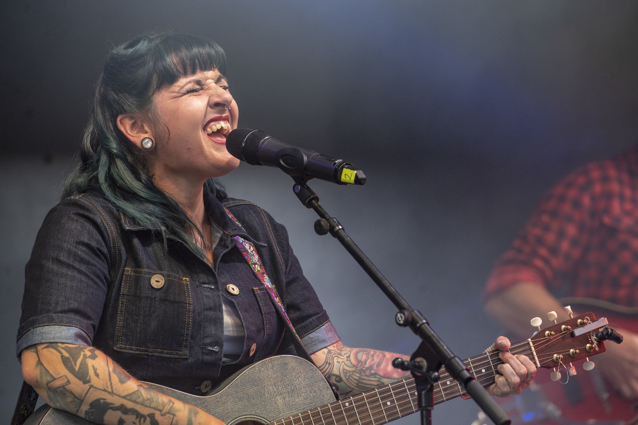 Woman with guitar singing