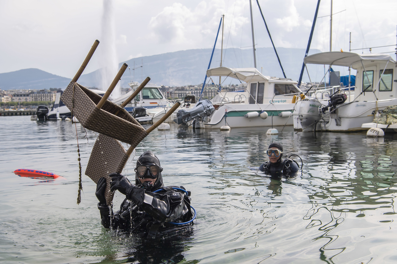 Diver pulls a chair out of Lake Geneva