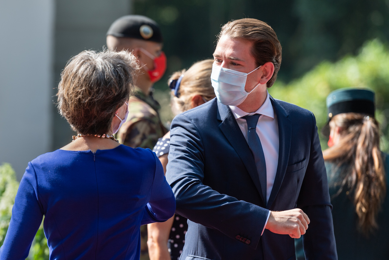 Simonetta Sommaruga and Sebastian Kurz greet with elbows