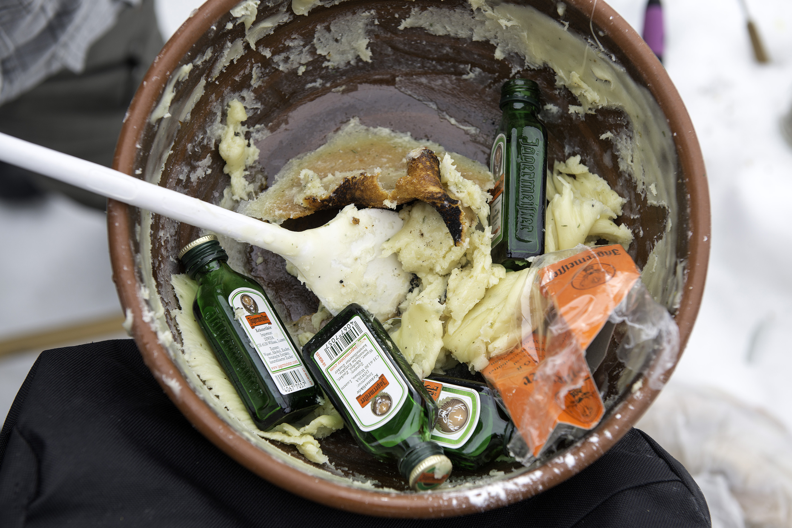 empty shot glasses in fondue pan