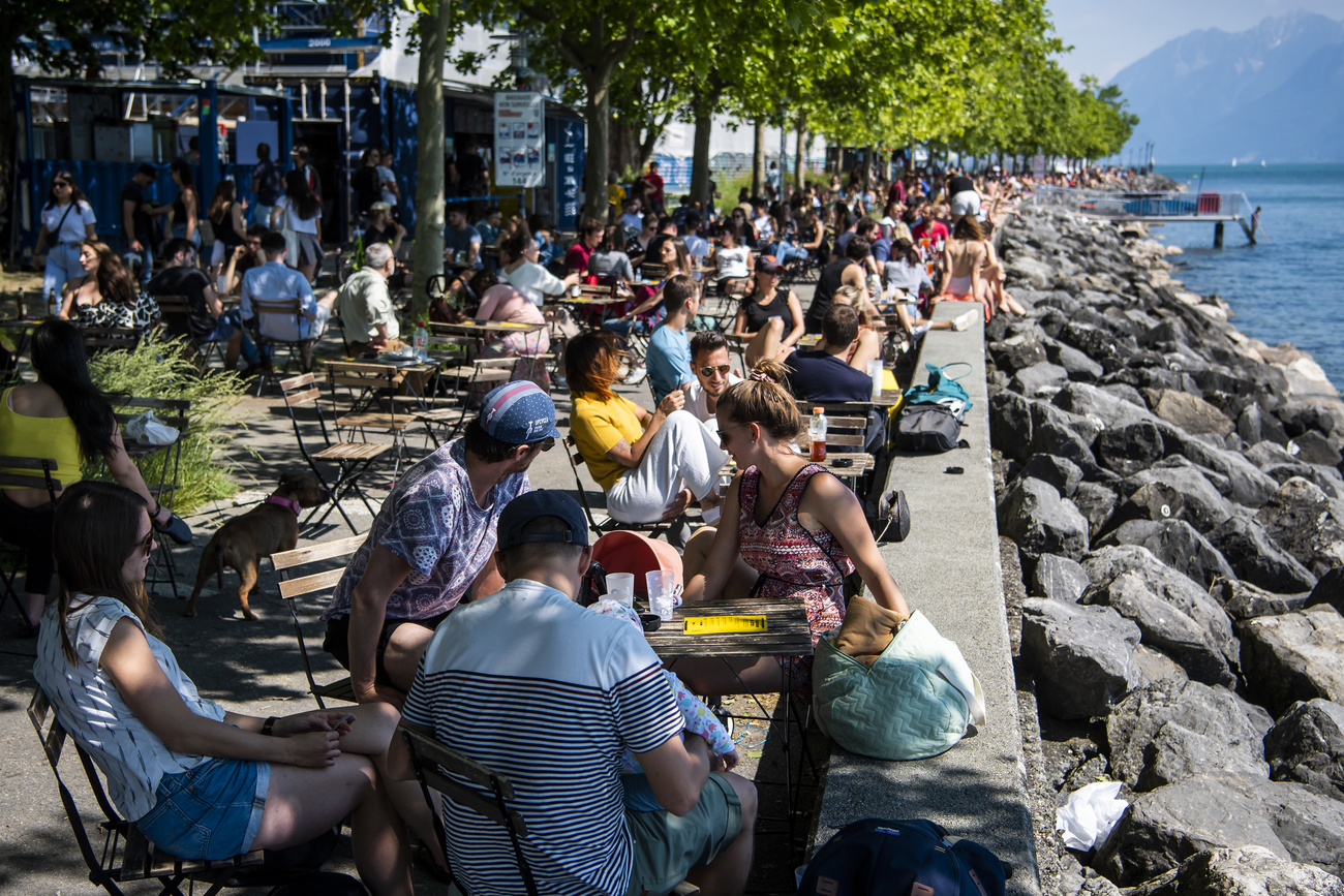 People in a lakeside cate