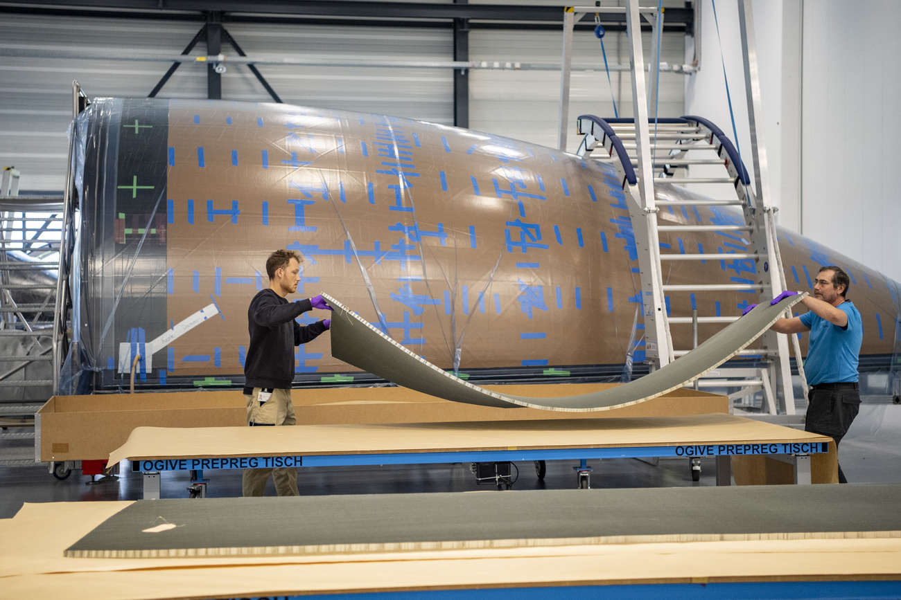 Two workers at a production plant of Ruag International