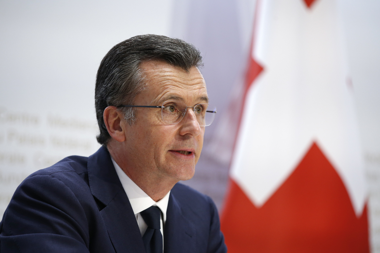 Hildebrand with Swiss flag in background