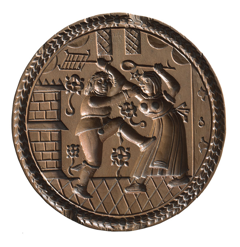 Rundes Gebäckmodel aus Holz mit einem handfesten Ehestreit