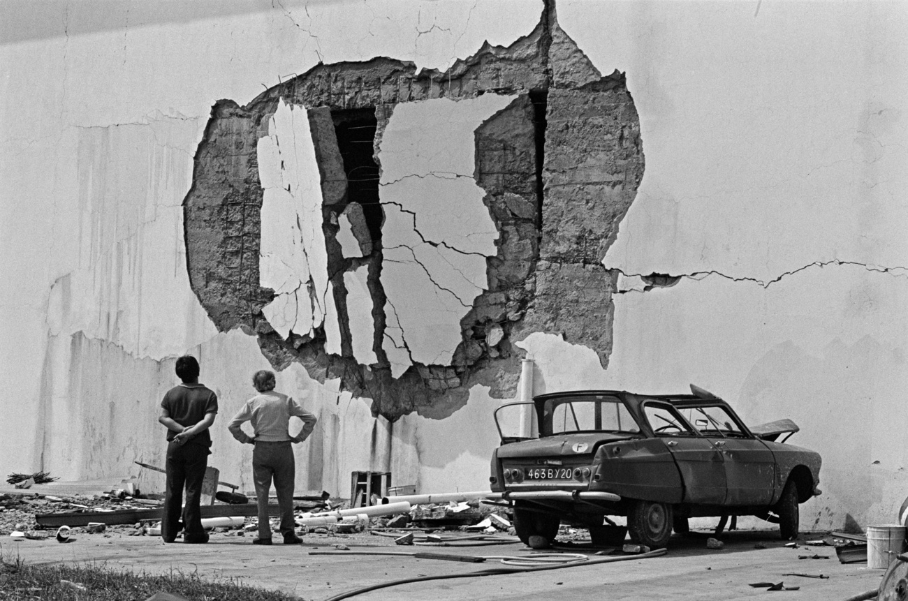 Two people stare at the results of the attack