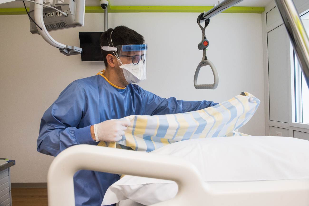 Male nurse and hospital bed