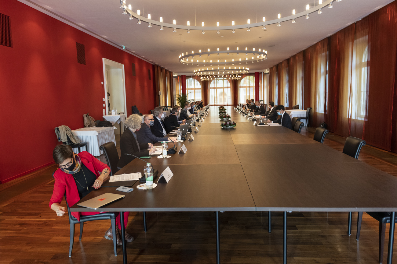 People sitting a long conference table