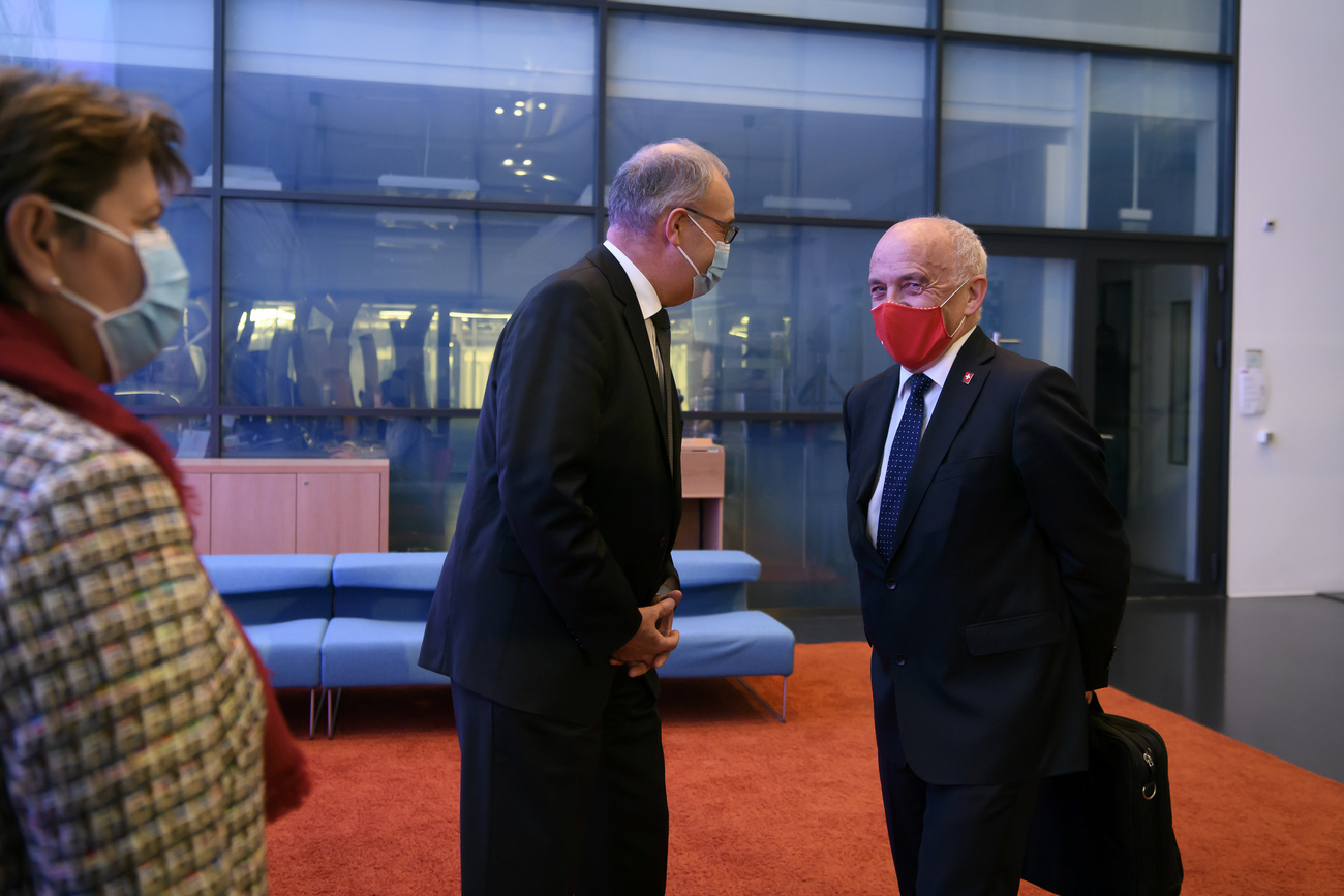 Three Swiss government minsters in the lobby of the press room