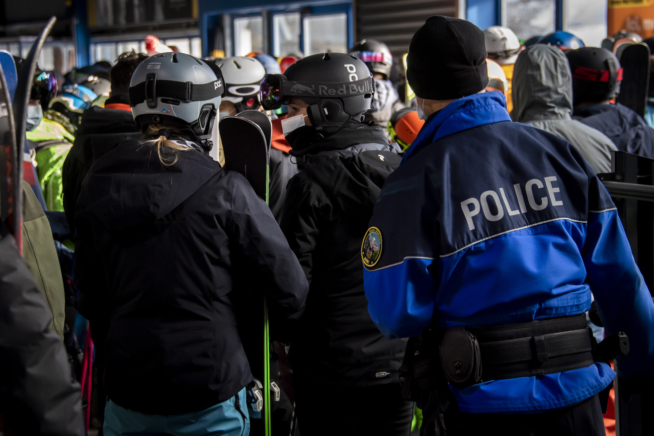 Policeman checking skiers