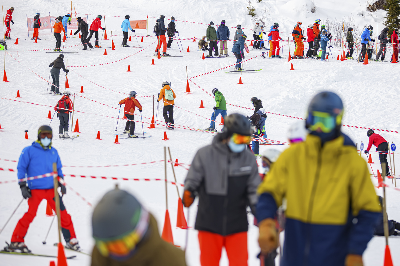 Skiers wearing masks