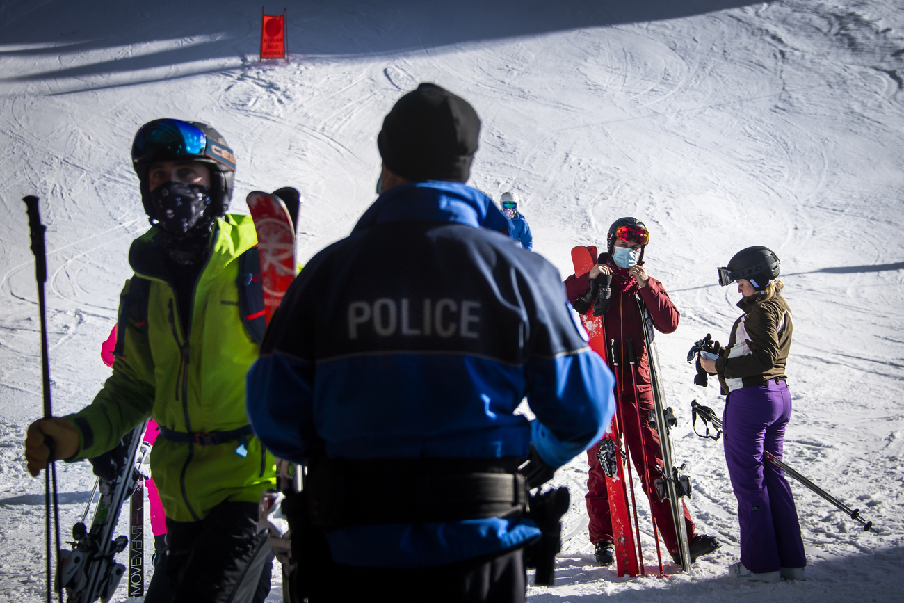 Policeman checking skiers