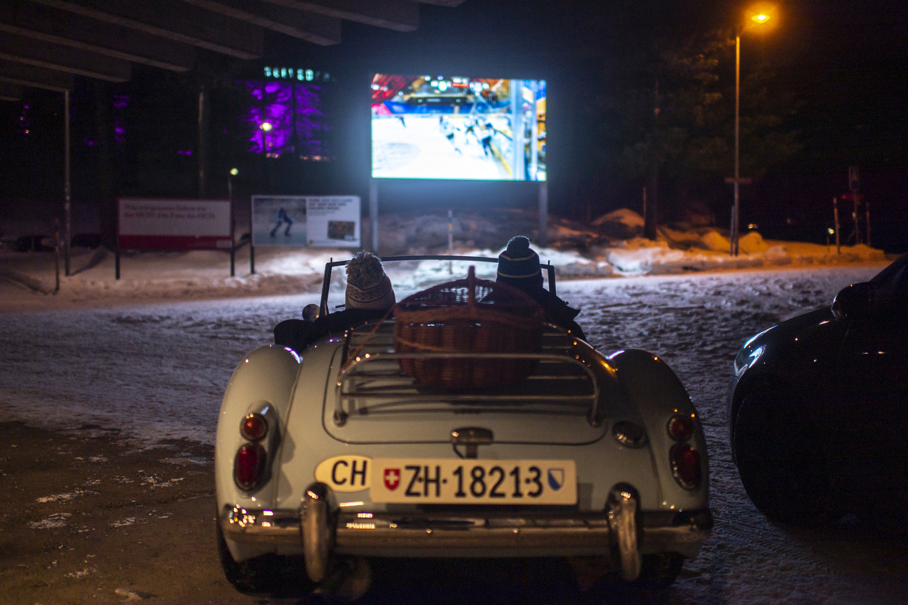 Watching the match in a car