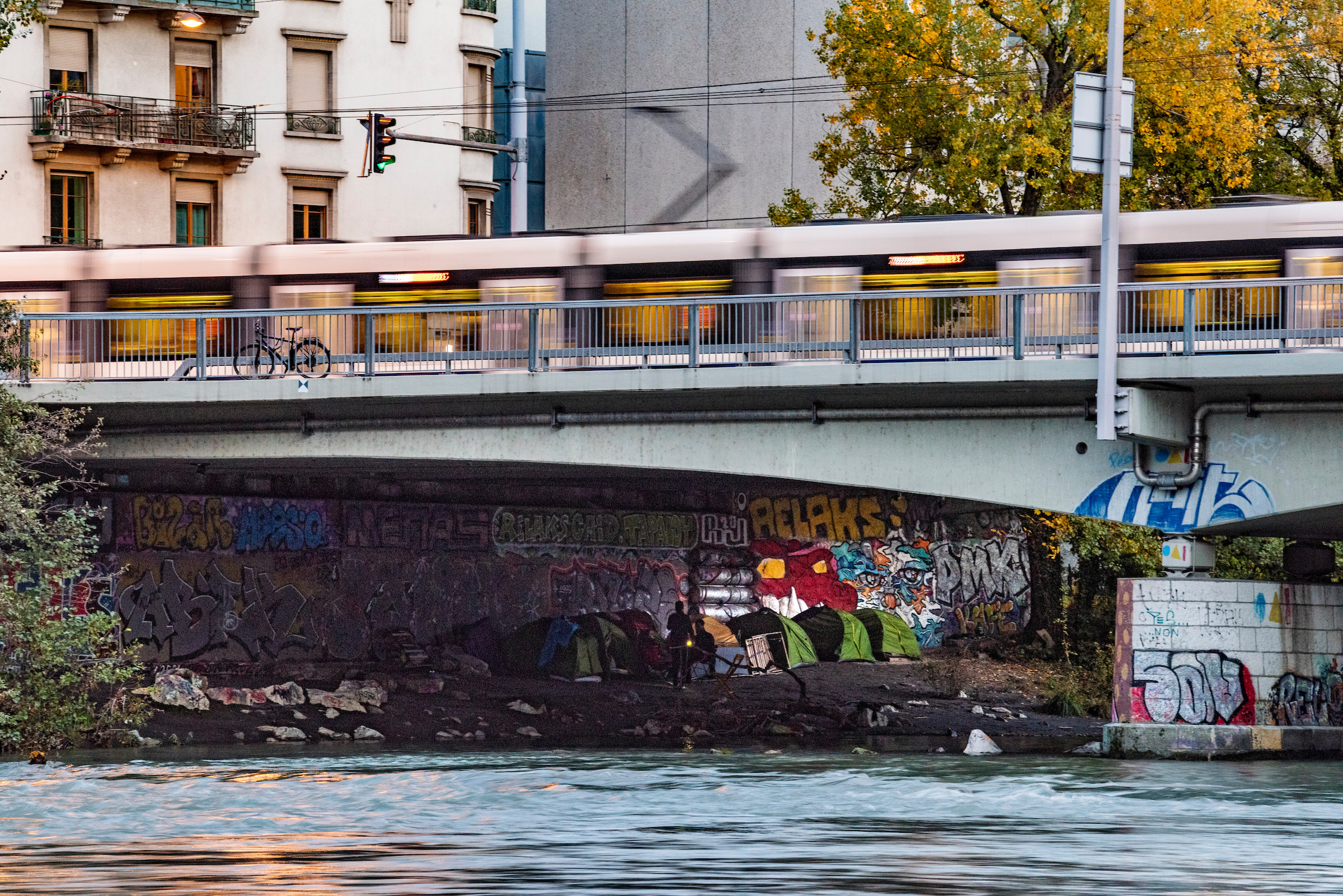 Tents of homeless people under a bridge in Geneva