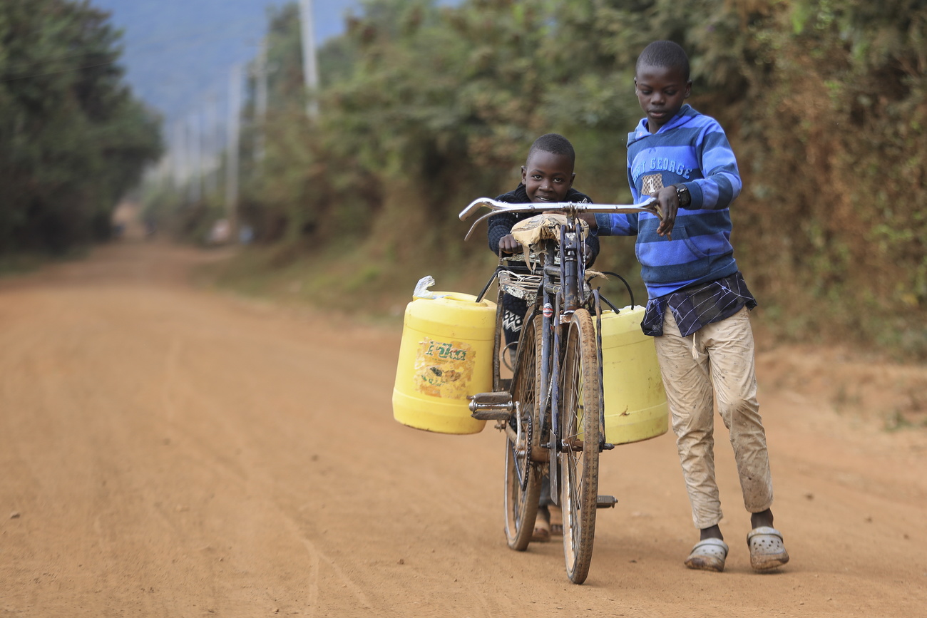 Two African boys collecting water