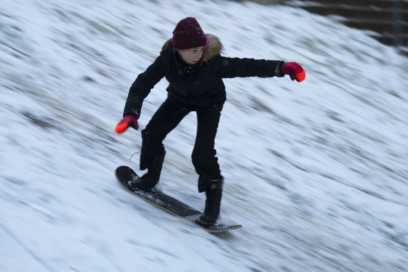A boy rides his board
