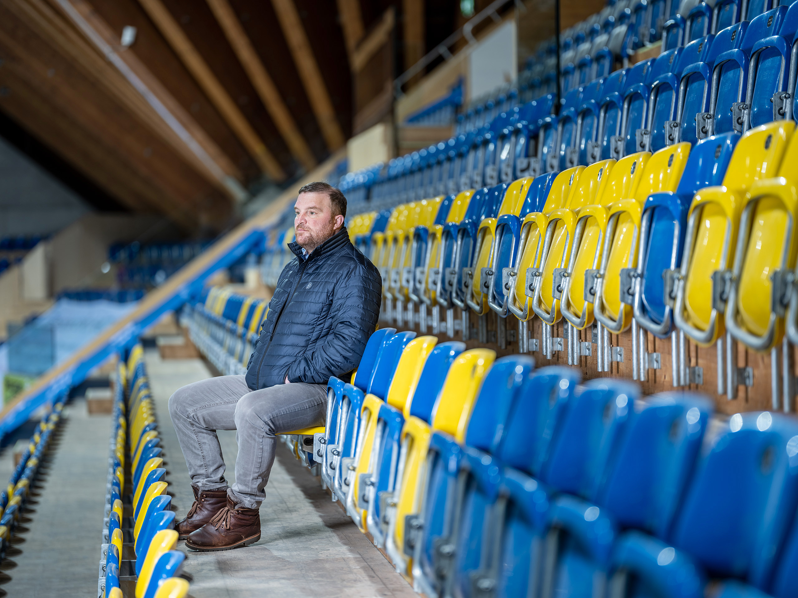 man in empty stadium