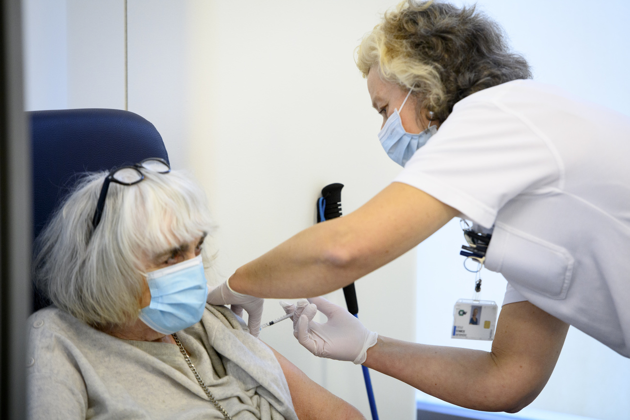 Patient gets Covid jab in Lausanne.