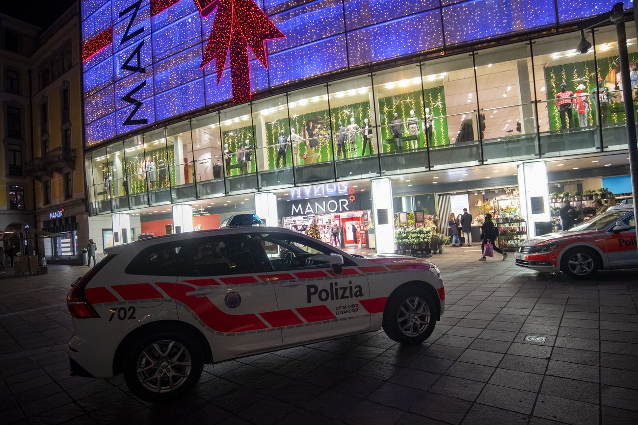 Police cars outside a shop